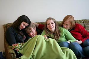 Chloe is not sure why we're all squished on the couch