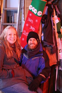 Chloe sits on Santa's lap to ask for toys